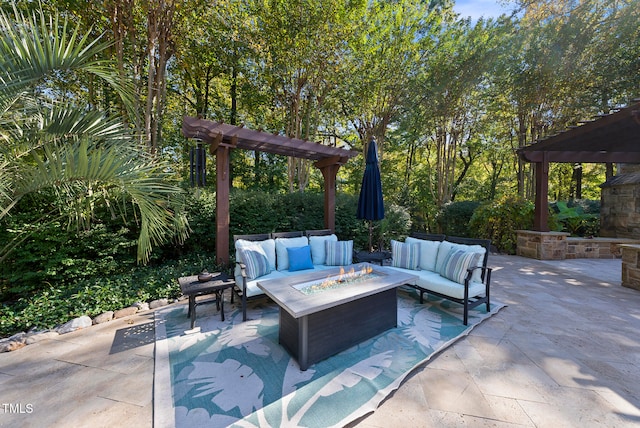 view of patio featuring a pergola and an outdoor living space with a fire pit