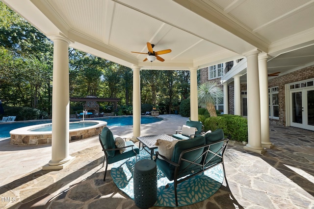 view of patio with ceiling fan, an outdoor living space, and a pool with hot tub