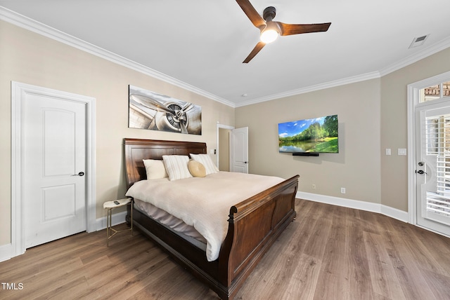 bedroom with access to exterior, hardwood / wood-style floors, ceiling fan, and ornamental molding