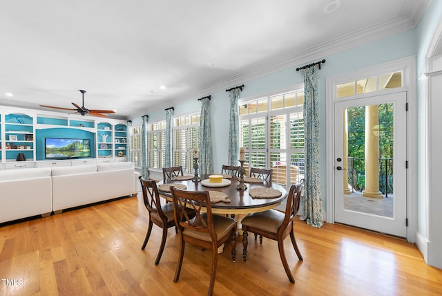 dining room with light wood-type flooring, ceiling fan, and ornamental molding