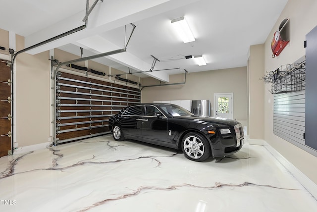 garage with stainless steel fridge