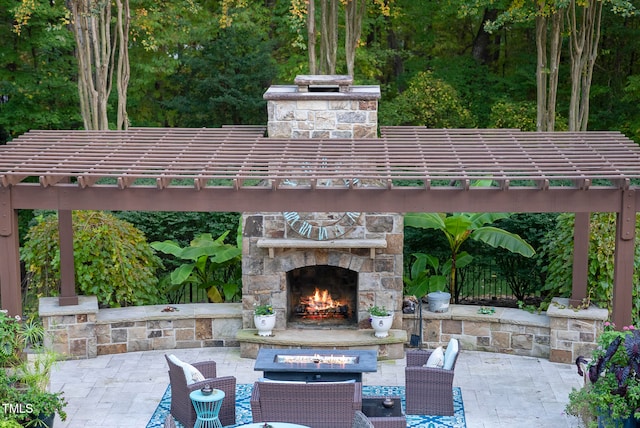 view of patio featuring an outdoor stone fireplace