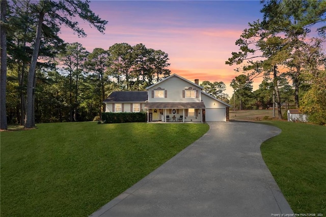 view of front of home featuring a lawn and a porch