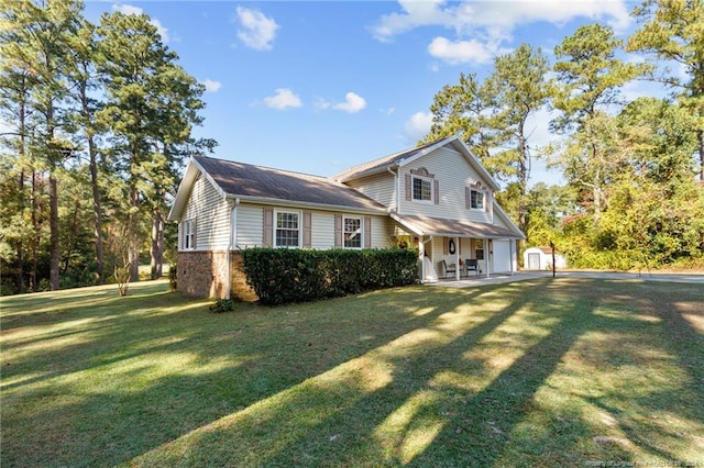 view of front of house featuring covered porch and a front lawn