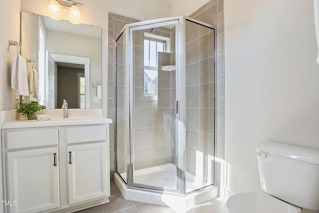 bathroom with vanity, toilet, and walk in shower