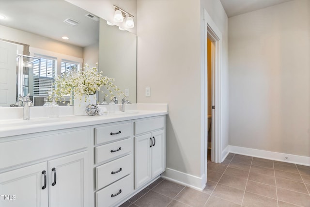 bathroom with vanity and tile patterned floors