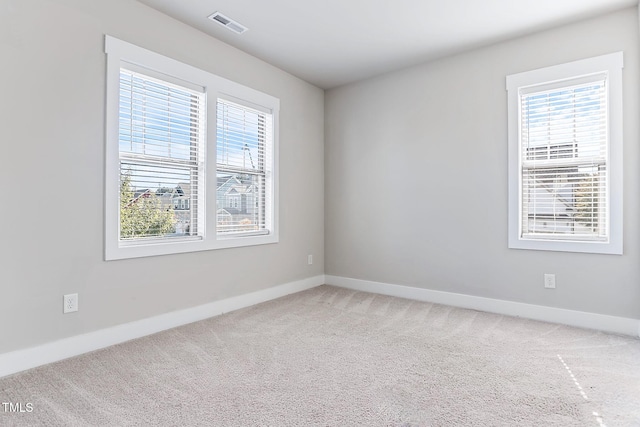 spare room featuring carpet flooring