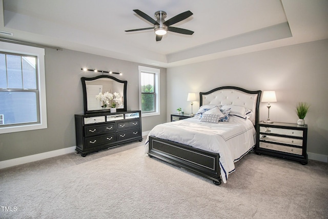 bedroom featuring multiple windows, carpet, and ceiling fan