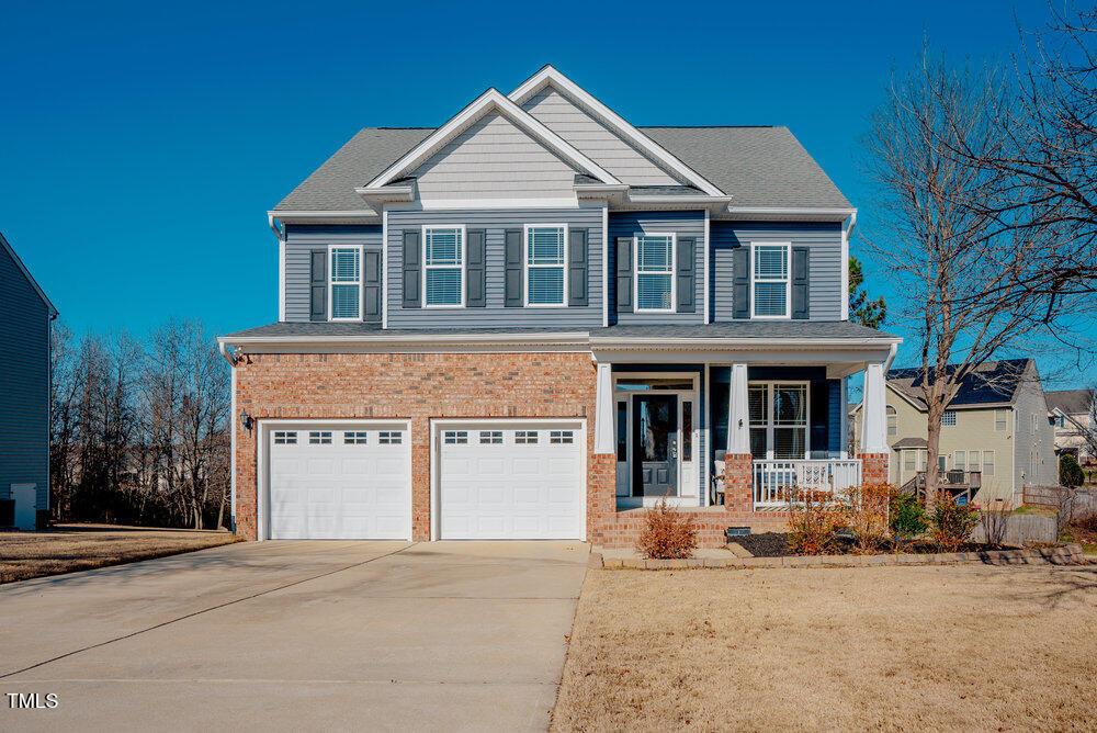 craftsman-style home with a garage and covered porch