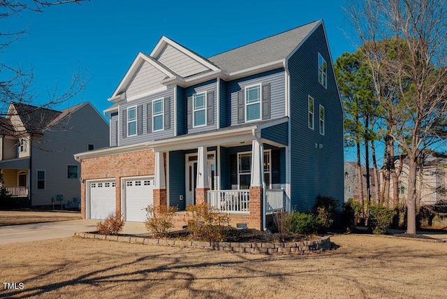 craftsman inspired home with a garage, a front lawn, and a porch