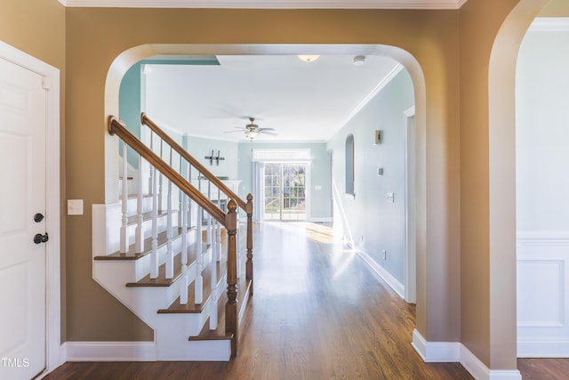 corridor featuring ornamental molding and dark hardwood / wood-style floors