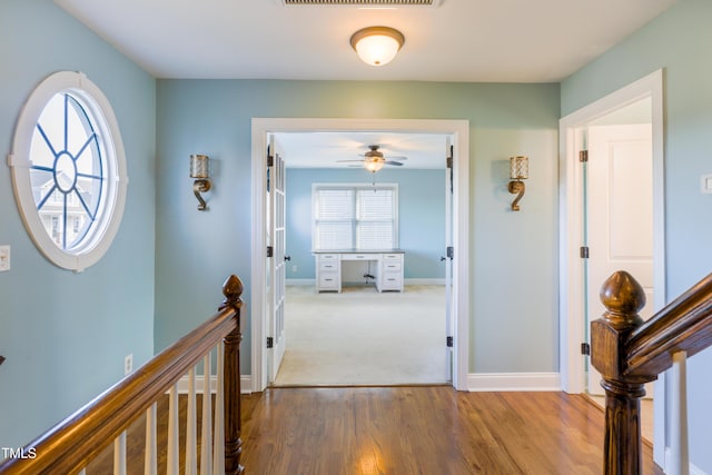 hallway featuring wood-type flooring