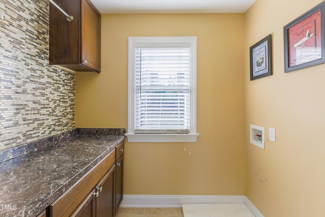 laundry room featuring cabinets and hookup for a washing machine