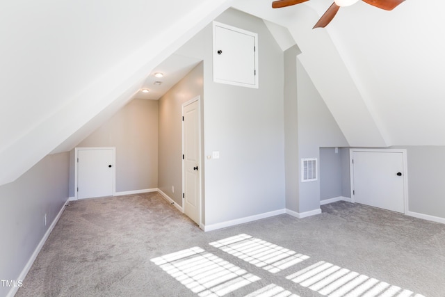 bonus room featuring lofted ceiling, light colored carpet, and ceiling fan