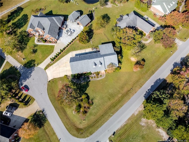 birds eye view of property with a residential view