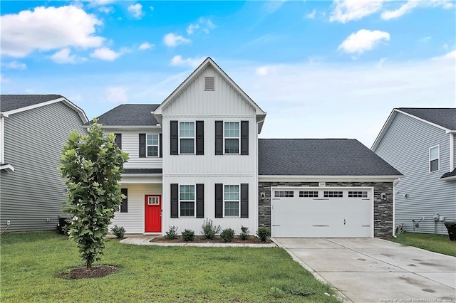 view of front of property with a garage and a front lawn