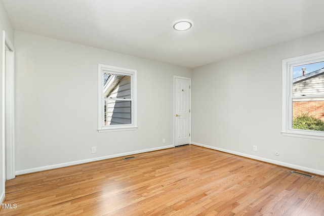 unfurnished room featuring light hardwood / wood-style flooring