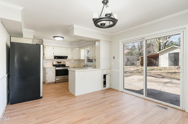 kitchen with kitchen peninsula, stainless steel appliances, exhaust hood, white cabinets, and light hardwood / wood-style floors