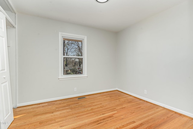 spare room with light wood-type flooring