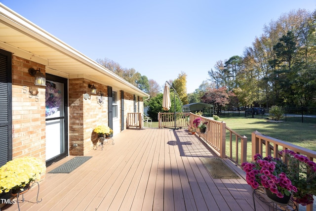 wooden deck with a yard