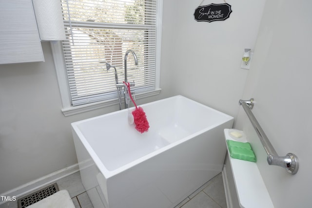 bathroom featuring a bathtub and tile patterned flooring