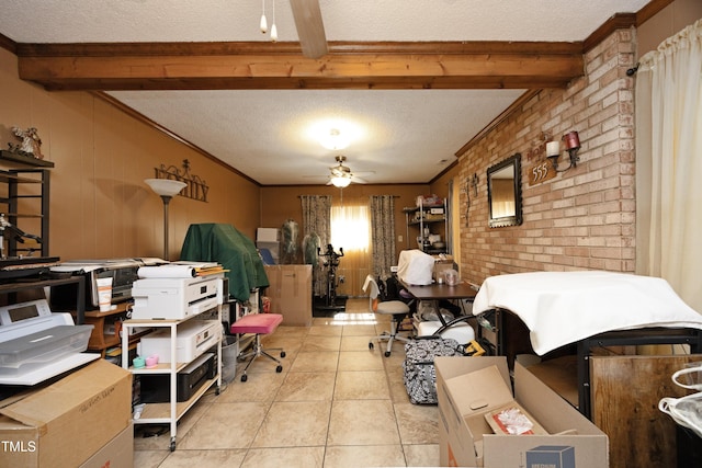 home office with a textured ceiling, light tile patterned floors, and beamed ceiling