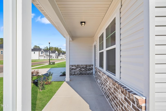 view of patio featuring a residential view and covered porch