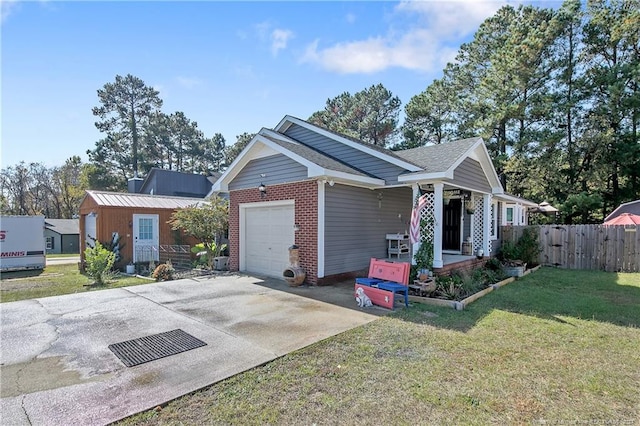 view of front of property with a front yard and a garage