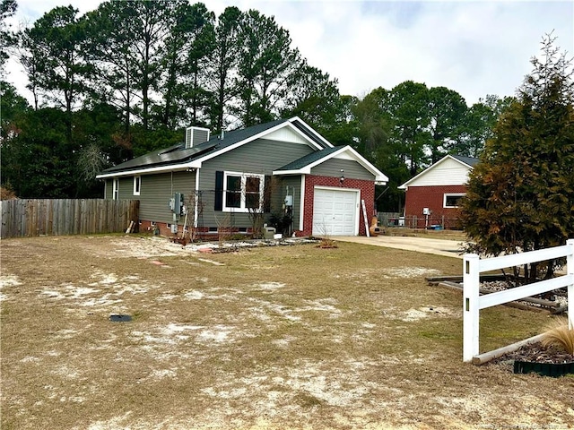 ranch-style house featuring an attached garage, crawl space, fence, and concrete driveway