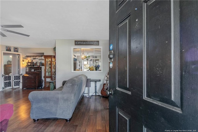 foyer entrance featuring a ceiling fan and wood finished floors