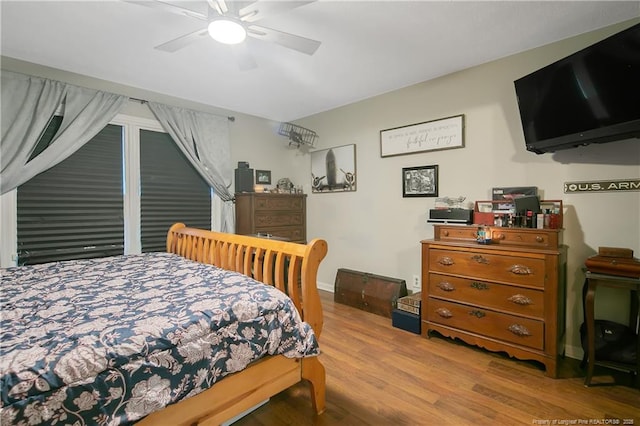 bedroom featuring ceiling fan and wood finished floors