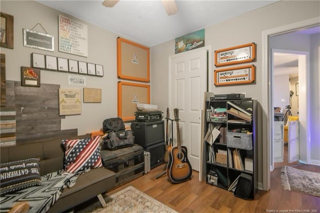 interior space with ceiling fan and wood finished floors