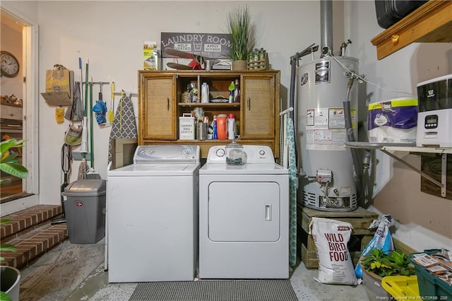 laundry area featuring water heater, laundry area, and washing machine and dryer