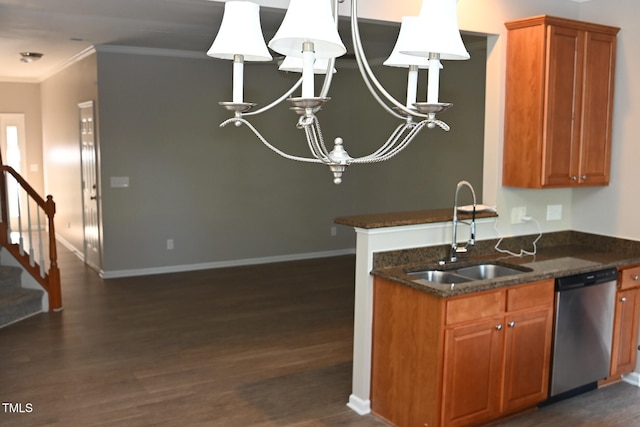 kitchen with dishwasher, sink, dark hardwood / wood-style floors, dark stone counters, and a chandelier