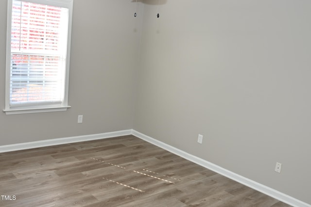 spare room with hardwood / wood-style floors