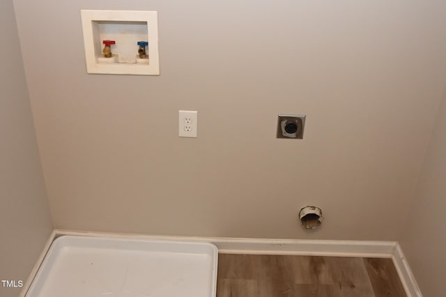 washroom featuring hookup for an electric dryer, hardwood / wood-style floors, and hookup for a washing machine