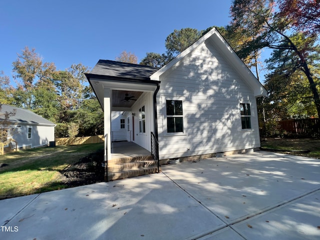 view of home's exterior featuring ceiling fan