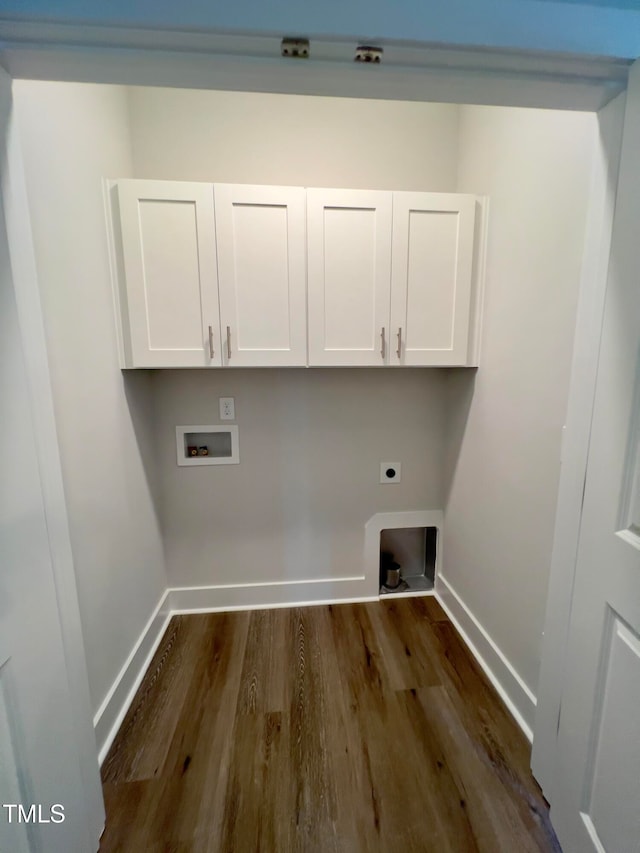 laundry area with cabinets, washer hookup, dark hardwood / wood-style floors, and electric dryer hookup