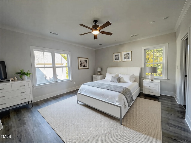 bedroom featuring multiple windows, ornamental molding, dark wood-type flooring, and ceiling fan