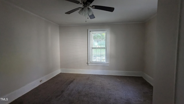 carpeted empty room featuring ornamental molding and ceiling fan