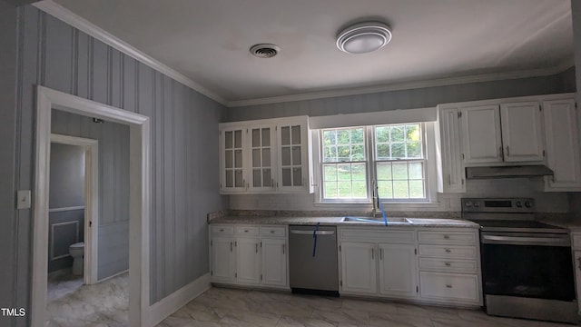 kitchen with tasteful backsplash, white cabinetry, ornamental molding, sink, and stainless steel appliances