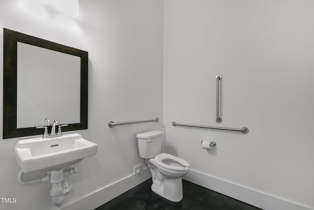 bathroom featuring concrete flooring and toilet