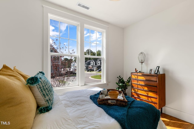 bedroom with hardwood / wood-style floors