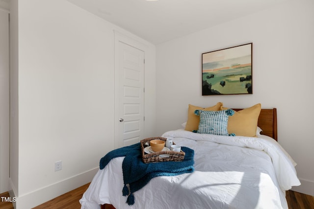 bedroom with hardwood / wood-style floors