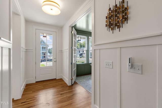 doorway to outside with light hardwood / wood-style flooring and plenty of natural light