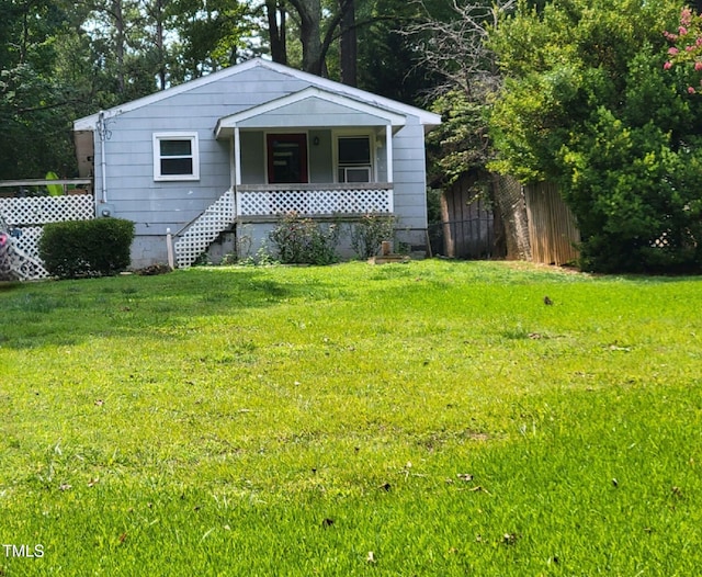 view of front of home featuring a front lawn and a porch