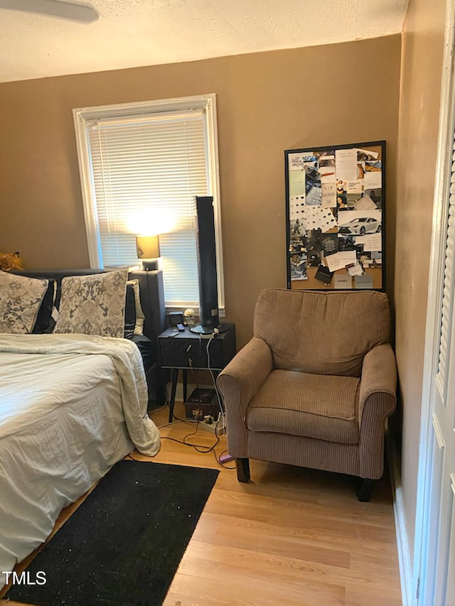 bedroom featuring wood finished floors