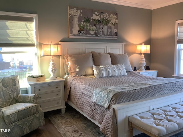 bedroom featuring ornamental molding and dark hardwood / wood-style flooring