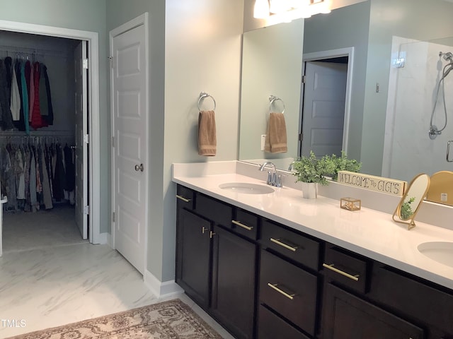 bathroom with vanity and a shower with shower door