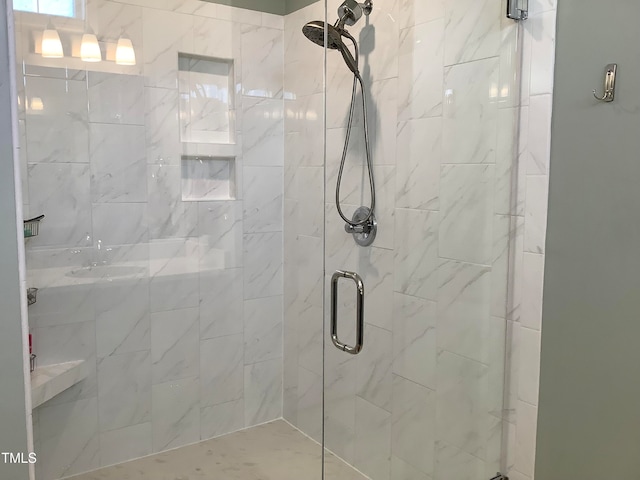 bathroom with a shower with shower door